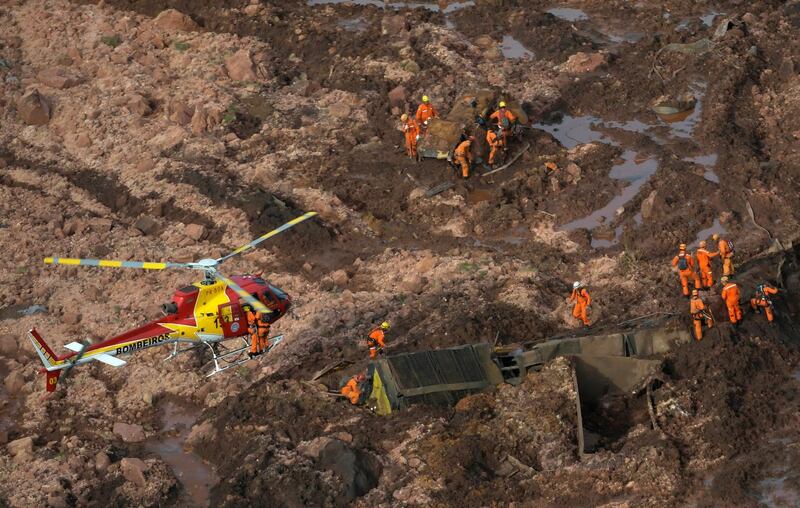 Rescue crew work dig through the sludge from a burst dam owned by Brazilian miner Vale SA Reuters