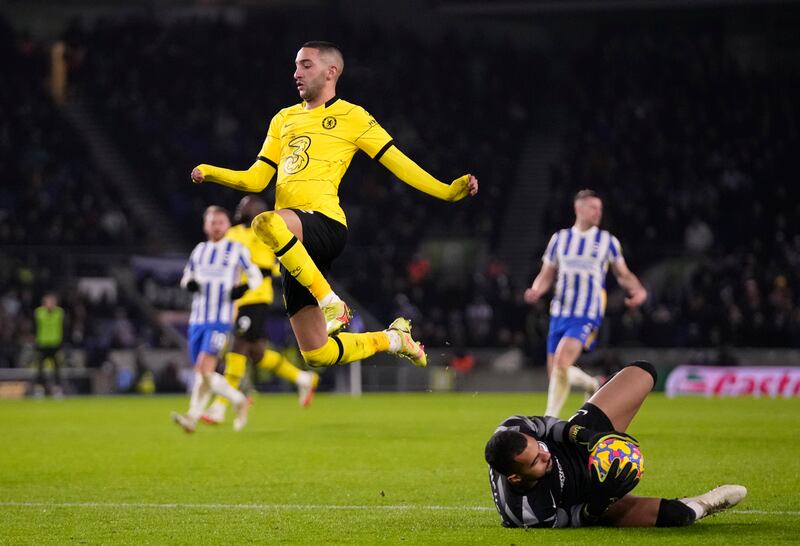 Brighton's goalkeeper Robert Sanchez, right, makes a save in front of Chelsea's Hakim Ziyech. AP Photo