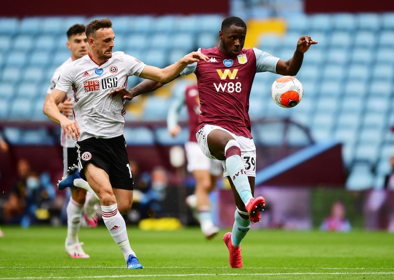 Aston Villa's Keinan Davis challenges Sheffield United's Jack Robinson. Reuters