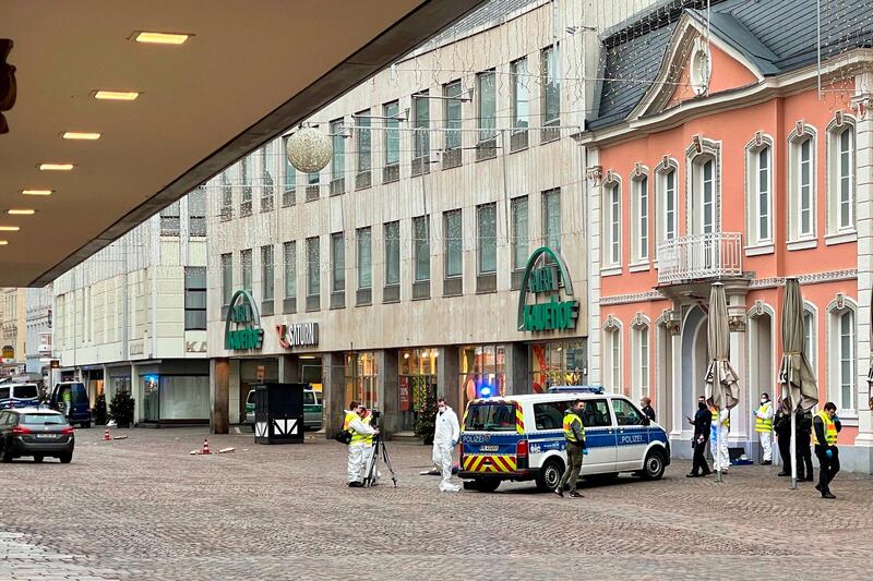 Police and forensic police investigate at one of the scenes where a car drove into pedestrians the center of Trier. AFP