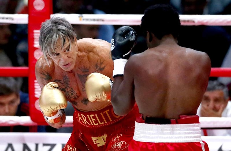 Mickey Rourke fights with Elliot Seymour during their bout in Moscow. Yuri Kochetkov / EPA