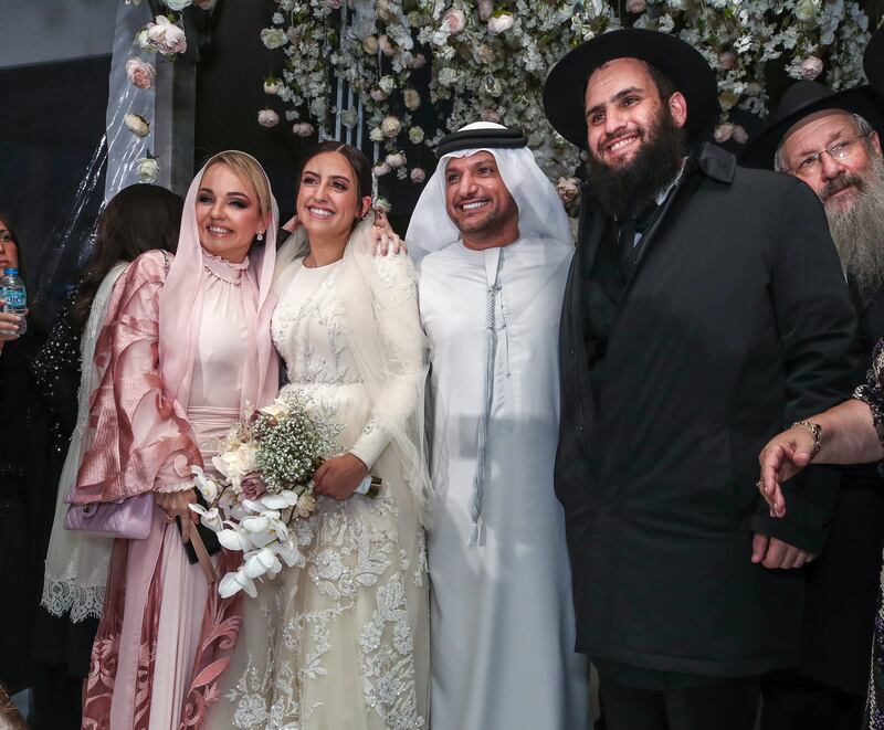 The newlyweds with Dr Omar Al Muthanna and wife, Shamma Mohammed. 