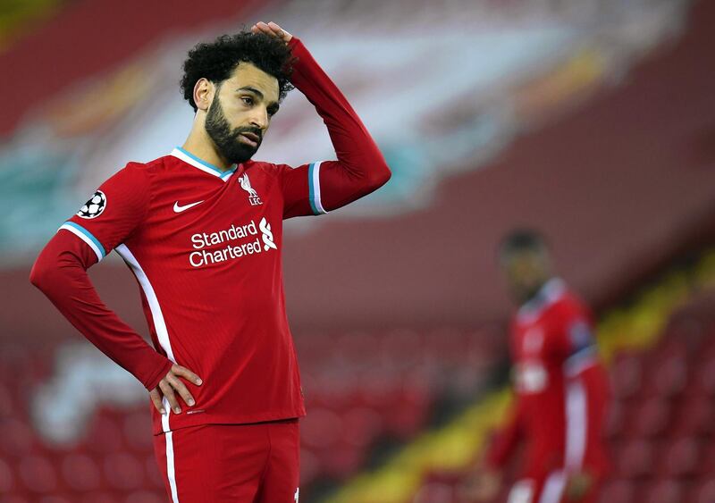 epa09135907 Liverpool's Mohamed Salah reacts during the UEFA Champions League quarter final, second leg soccer match between Liverpool FC and Real Madrid in Liverpool, Britain, 14 April 2021.  EPA/Peter Powell