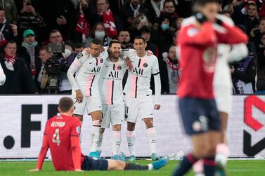 PSG's Lionel Messi, third from left, celebrates with his teammates after scoring his side's third goal during the French League One soccer match between Lille and Paris Saint Germain at Pierre Mauroy stadium in Villeneuve d'Ascq in Lille, France, Sunday, Feb.  6, 2022.  (AP Photo / Michel Spingler)