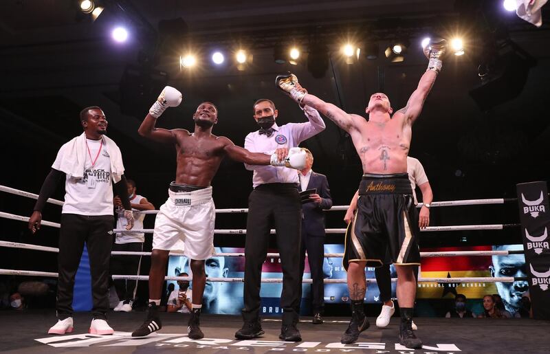 Anthony de Bruijn raises his arms in victory after getting the decision against Emmanuel Noi Mensah in their UBO Inter-Continental Lightweight title fight in Dubai. EPA