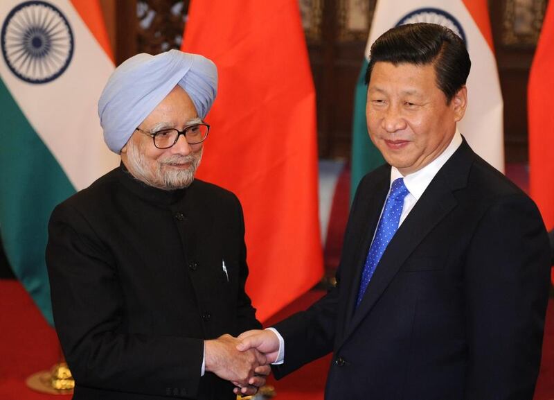 Indian prime minister Manmohan Singh shakes hands with Chinese premier Li Keqiang before their meeting at the Diaoyutai State Guesthouse. Kyodo News via Getty Images