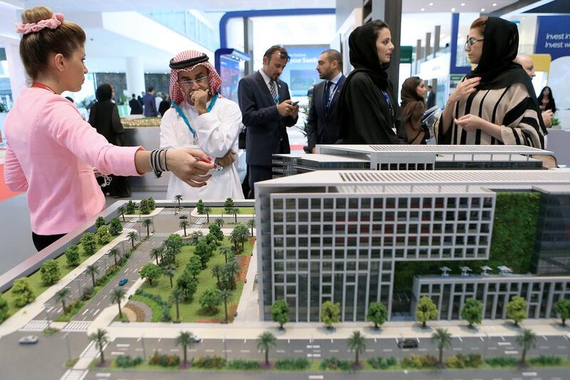 Visitors are briefed on the Park View project by Bloom Properties at Cityscape Abu Dhabi. Ravindranath K / The National