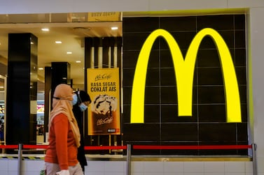 A lady wearing a face mask walks past the McDonald's restaurant. (Photo by Faris Hadziq / SOPA Images/Sipa USA)No Use Germany.