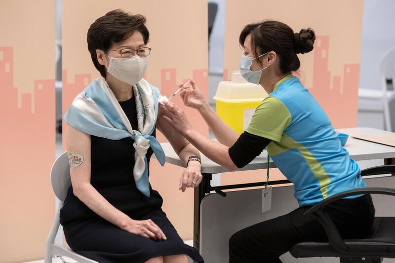Carrie Lam, Hong Kong's chief executive, receives her second dose of the Sinovac vaccine on Monday, March 22, 2021. Hong Kong expanded eligibility for vaccinations as it campaigns to encourage more of its 7.5 million population to get inoculated. Bloomberg