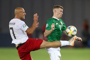 Republic of Ireland's James McClean, right, battles for possession with Jaba Kankava of Georgia. Reuters