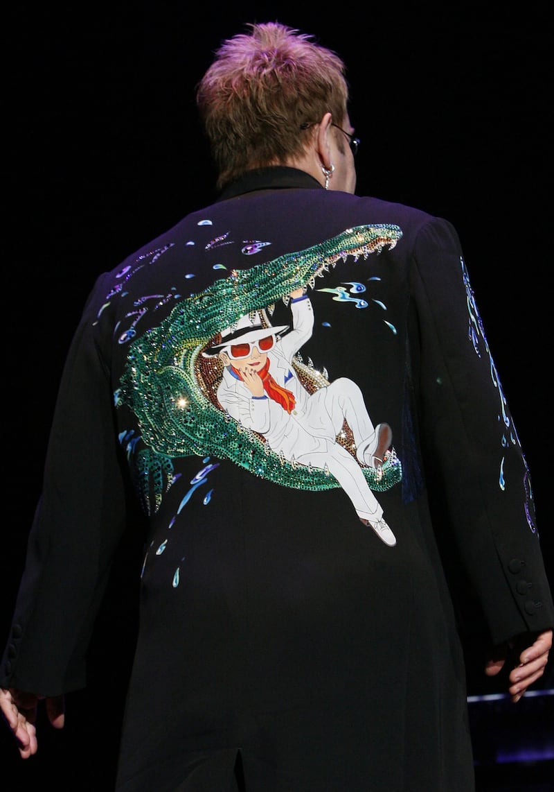 The crocodile detail on the back of Sir Elton's suit during a performance in Sydney, Australia. Getty Images