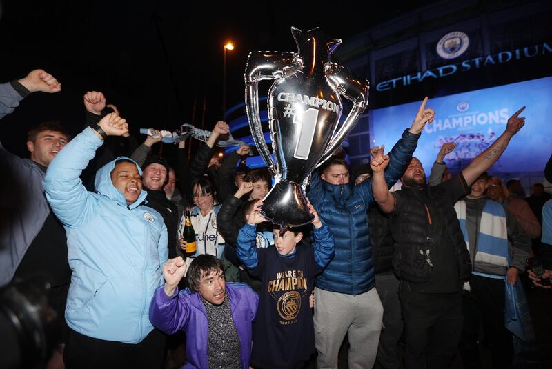 Soccer Football - Premier League - Manchester City fans celebrate winning the Premier League. Reuters