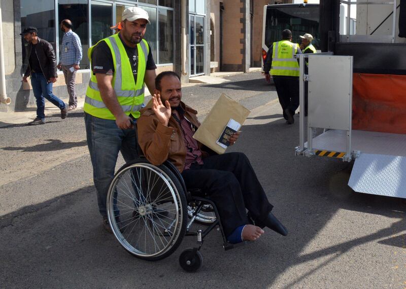 An airport worker pushes a sick Yemeni in a wheelchair before boarding a UN medical evacuation plane at Sana'a airport, Yemen.  EPA