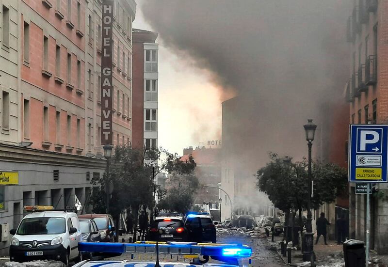 Smoke rises from the building in Toledo Street following a explosion in downtown Madrid. AP Photo