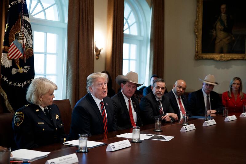 epa07276203 US President Donald J. Trump (2-L) participates in a roundtable discussion on border security and safe communities with State, local and community leaders in the Cabinet Room of the White House in Washington, DC, USA 11 January 2019. Picture with Trump are among others Chester County Sheriff Carolyn Bunny Welsh (L) and Jackson County Sheriff AJ Louderback (3-L). Te partial government shutdown, which is tied for the longest in US history, has affected about 800,000 federal workers.  EPA/SHAWN THEW