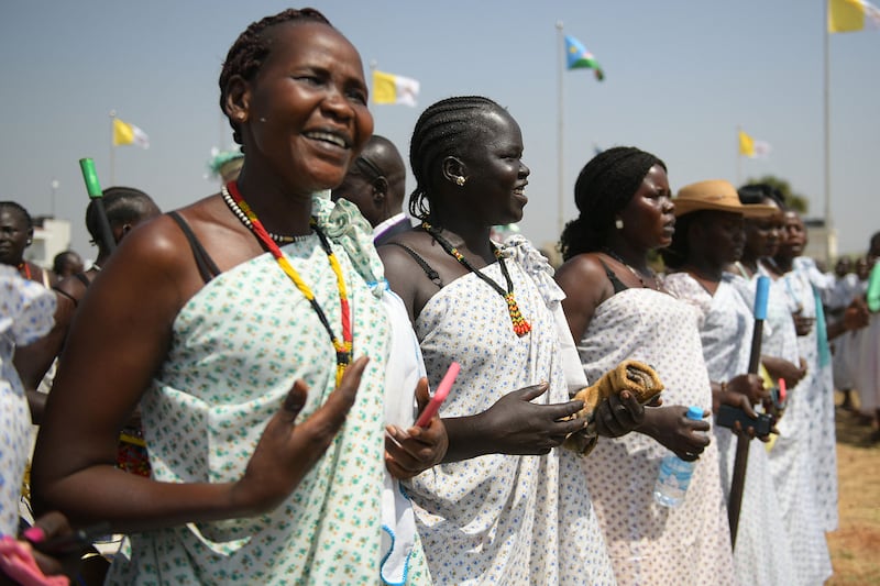 Traditional dancers welcome Pope Francis at the Juba International Airport. AFP