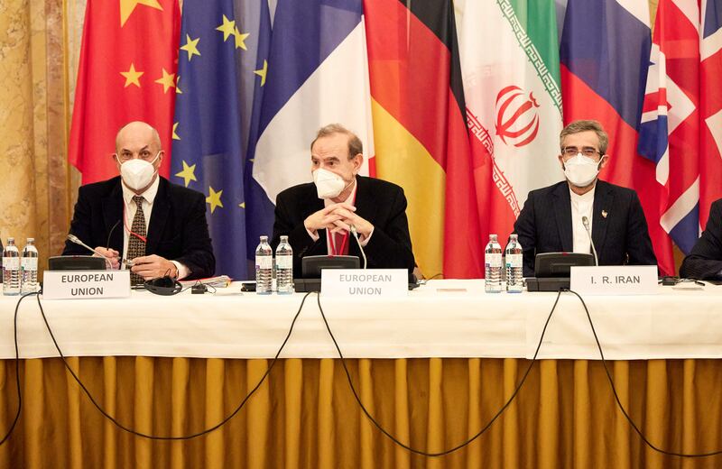Europe's top negotiator Enrique Mora, centre, and his Iranian equivalent Ali Bagheri, right, in Vienna, Austria. AFP