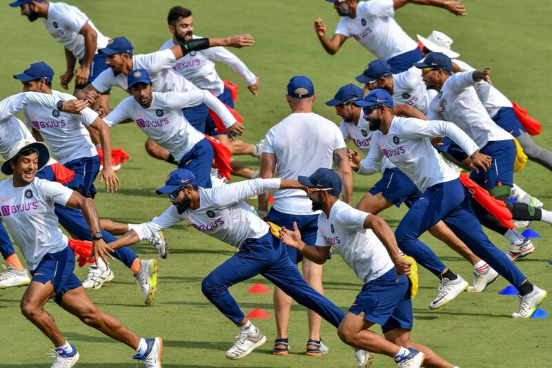 India's cricketers run during a training session on Tuesday, November 12. AFP