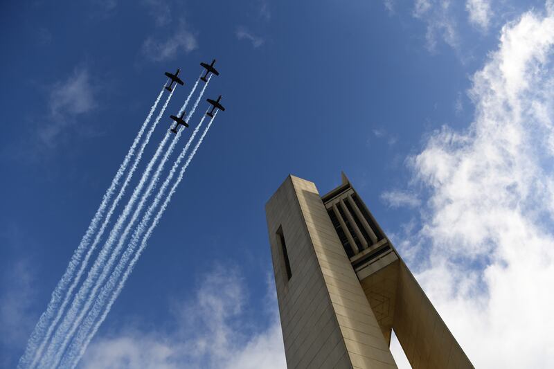 A Royal Australian Airforce flypast in front of The national Carillon in Canberra. Getty Images