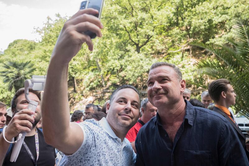 Schreiber poses for a selfie with a fan. AFP