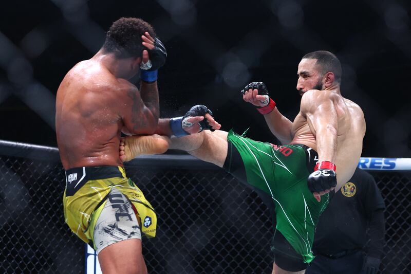 Belal Muhammad lands a kick on Gilbert Burns during their fight at UFC 288. USA Today