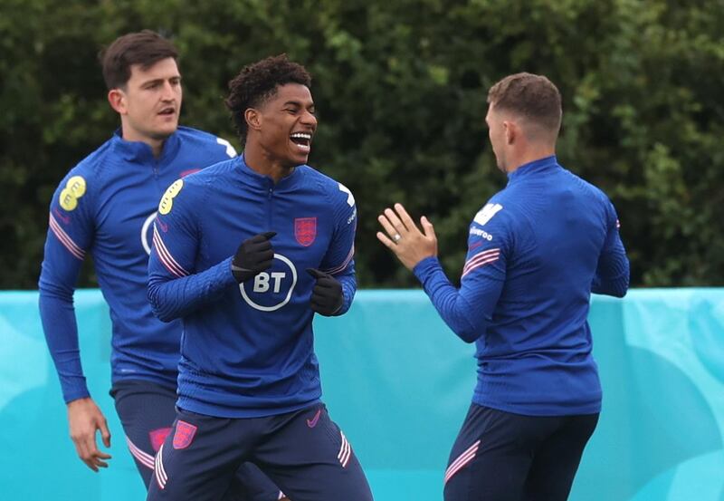 Left to right: Harry Maguire, Marcus Rashford and Kieran Trippier. Reuters
