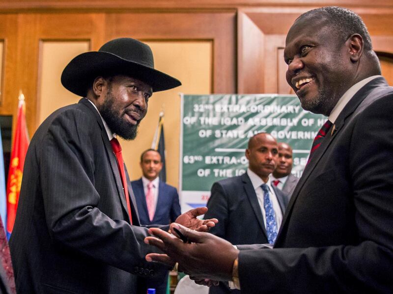 South Sudan's President Salva Kiir, left, and opposition leader Riek Machar shake hands during peace talks in Addis Ababa, Ethiopiam on June 21, 2018. AP Photo