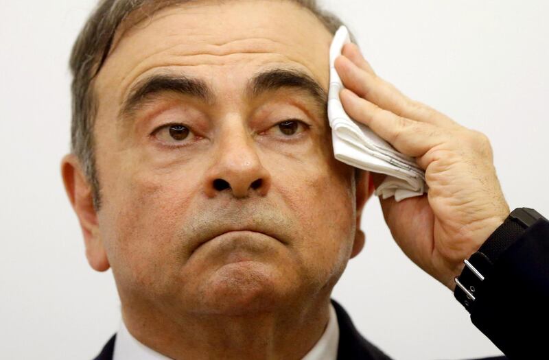 Former Nissan chairman wipes his brow during the marathon press conference. Reuters