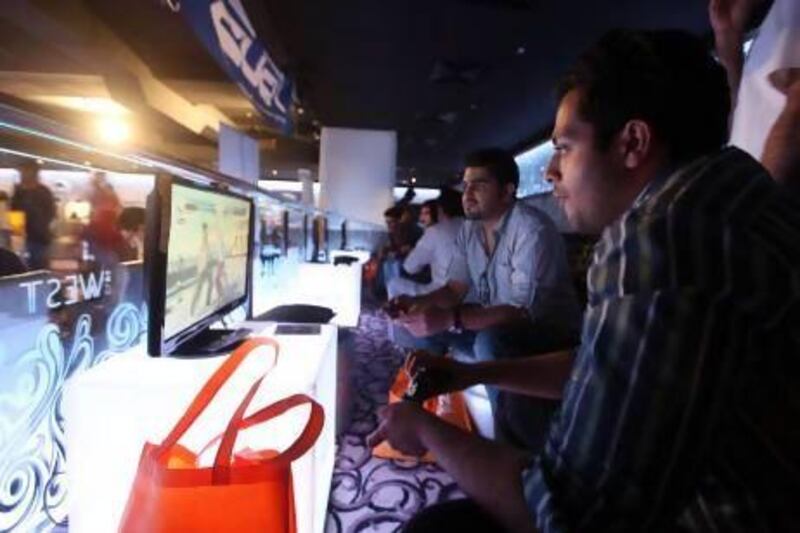 Visitors play at GamesFest at Club West, Grand Midwest Towers in Dubai Media City. Ravindranath K / The National