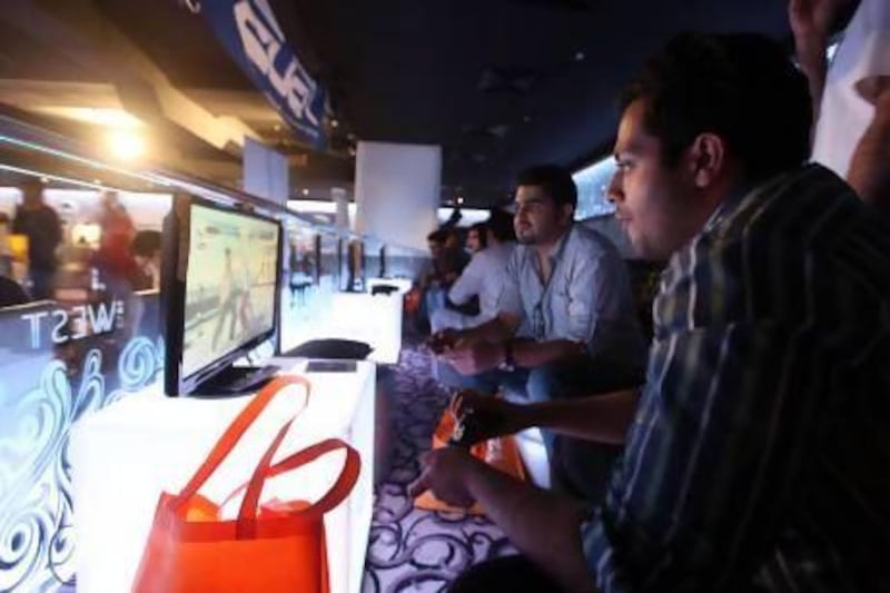 Visitors play at GamesFest at Club West, Grand Midwest Towers in Dubai Media City. Ravindranath K / The National