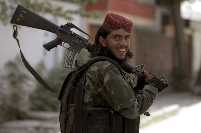A Taliban fighter patrols the Wazir Akbar Khan district of Kabul. AP