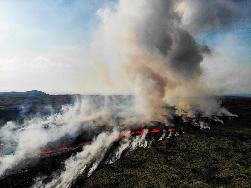 Smoke billows from flowing lava during a volcanic eruption near Litli Hrutur, south-west of Reykjavik in Iceland, on July 10. All photos: AFP