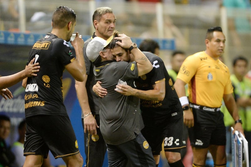 Dorados coach Diego Maradona celebrates with his players. Reuters