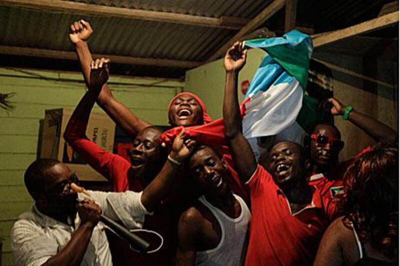 Fans of Equatorial Guinea celebrate beating Libya 1-0 in their opening African Cup of Nations match in Malabo, the country's capital.