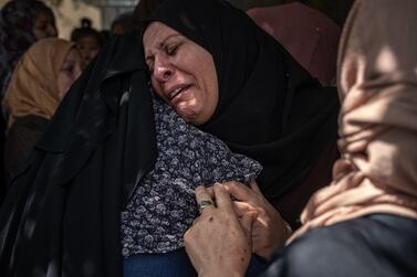 File photo: Relatives of Palestinian Ahmed Al-Shenbari, who was killed during an Israeli raid in Beit Hanoun city on the northern Gaza Strip, mourn during his funeral on May 11, 2021 in Gaza City, Gaza. Getty Images