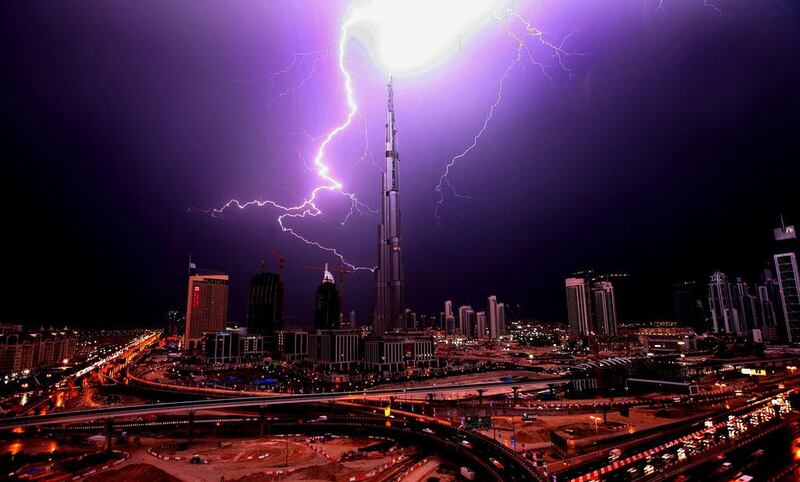 DUBAI-JANUARY 14,2009 - Web of lightning form over the Burj Khalifa. ( Paulo Vecina/The National )