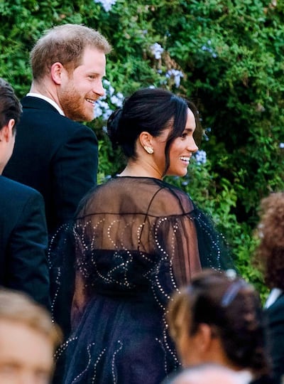 Britain's Prince Harry and his wife Meghan, Duchess of Sussex arrive to the wedding of Misha Nonoo and Michael Hess in Rome, Friday, Sept. 20, 2019. Britain's Prince Harry and his wife Meghan, Duchess of Sussex will attend the wedding of their friends before leaving on an official trip to Africa. (Claudio Peri/ANSA via AP)