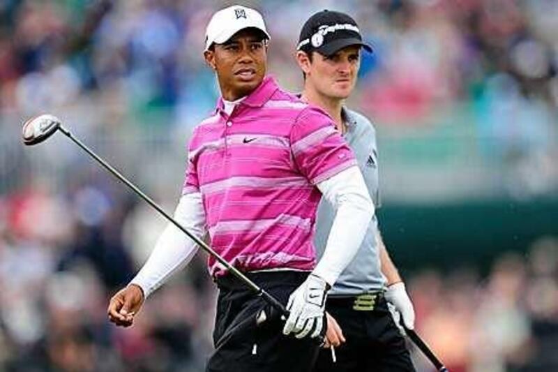 Tiger Woods was partnered by England's Justin Rose on his return to the British Open at the Old Course yesterday. The two could be on opposite sides at the Ryder Cup in October.