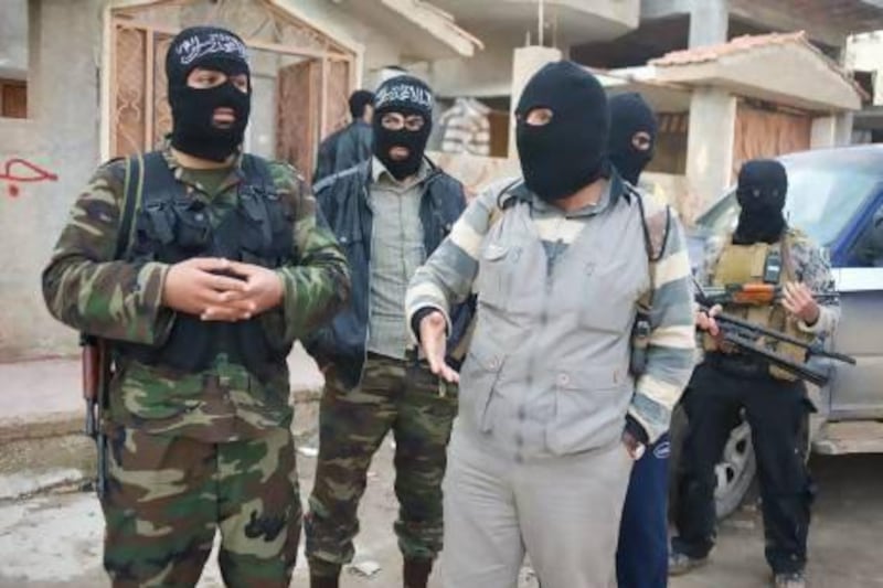 The man, who calls himself Sheikh Abu Ahmed alongside other member of Jabhat al Nusra.