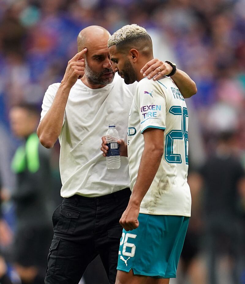 Manchester City manager Pep Guardiola with Riyad Mahrez after the Community Shield match at Wembley Stadium.