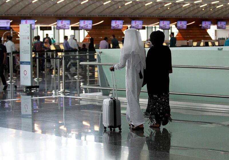 Passengers walk at Hamad International Airport in Doha, Qatar, June 7, 2017. REUTERS/Naseem Zeitoon