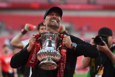 Liverpool manager Juergen Klopp celebrates with the trophy after winning the English FA Cup final between Chelsea FC and Liverpool FC at Wembley in London, Britain, 14 May 2022.   EPA/NEIL HALL EDITORIAL USE ONLY.  No use with unauthorized audio, video, data, fixture lists, club/league logos or 'live' services.  Online in-match use limited to 120 images, no video emulation.  No use in betting, games or single club / league / player publications