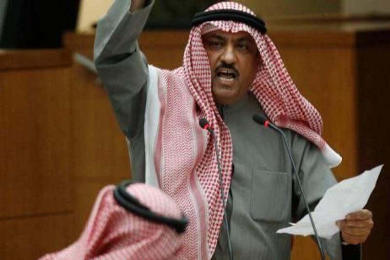 Kuwaiti opposition MP Mussallam al-Barrak addresses a heated session in parliament in Kuwait City on January 12, 2011, during which lawmakers decided unanimously to form a parliamentary panel to investigate allegations a man died as a result of police torture, after pressure on the interior minister to open a probe. AFP PHOTO/YASSER AL-ZAYYAT
 *** Local Caption ***  035566-01-08.jpg