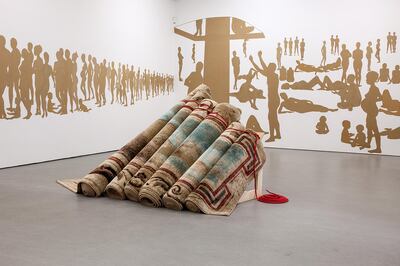 Turkey’s Hera Buyuktasciyan’s ‘Destroy Your House, Build Up a Boat, Save Life’ uses carpets embroidered with ethnic motifs from the Toronto area.