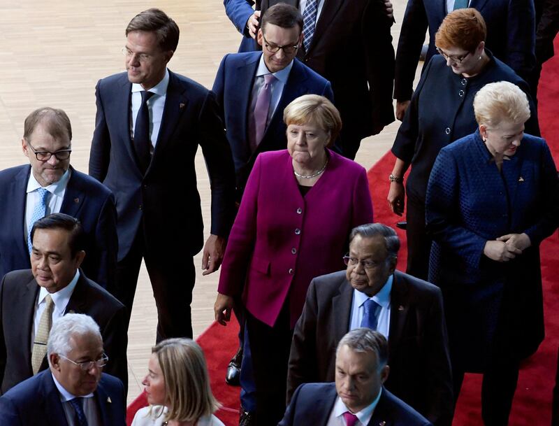 German Chancellor Angela Merkel, Lithuania's President Dalia Grybauskaite, European Union High Representative for Foreign Affairs and Security Policy Federica Mogherini, Australia's Minister for Foreign Affairs Marise Payne, Dutch Prime Minister Mark Rutte, Poland's Prime Minister Mateusz Morawiecki, Finland's Prime Minister Juha Sipila, Hungarian Prime Minister Viktor Orban, Portugal's Prime Minister Antonio Costa, Bangladesh's Minister for Foreign Affairs Abul Hassan Mahmood Ali and Prime Minister of Thailand Prayut Chan-o-cha arrive for a group photo at the ASEM leaders summit in Brussels, Belgium October 19, 2018. REUTERS/Piroschka van de Wouw