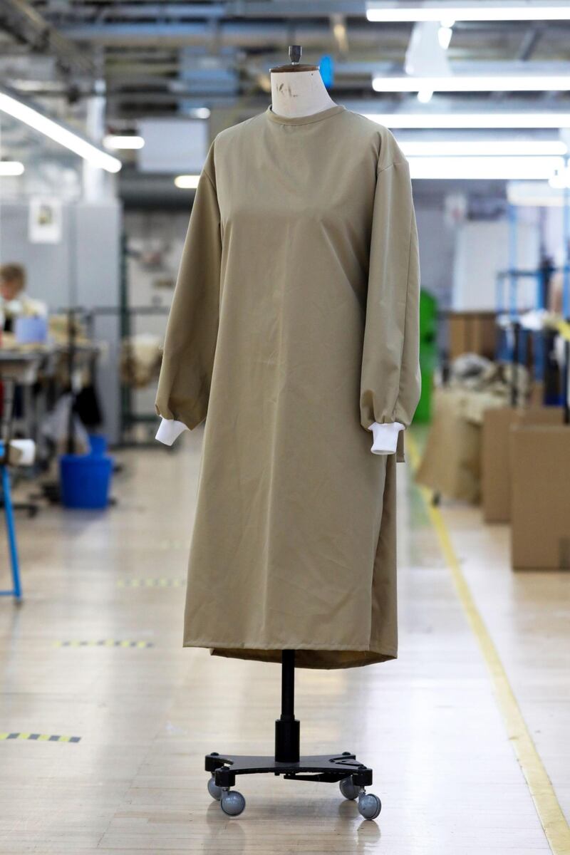A completed protective gown for a worker in the U.K. National Health Service (NHS) sits on a mannequin at the Burberry Group Plc factory in Castleford, U.K., on Tuesday, April 21, 2020. The U.K. ran the risks running out of protective equipment for its hospital staff as half the doctors working in high-risk areas reported supply shortages in an April survey by the British Medical Association. Photographer: Chris Ratcliffe/Bloomberg