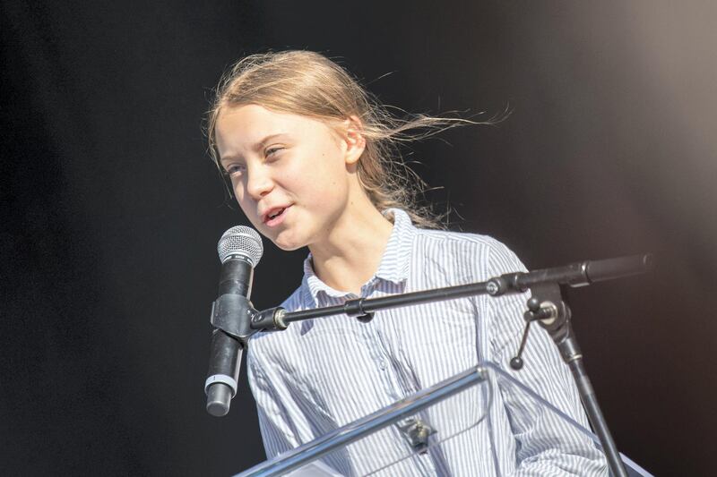 Swedish climate activist Greta Thunberg speaks to the crowd of protesters during the global climate strike in Montreal, Canada, on September 27 2019. - Teen activist Greta Thunberg called on Canadian Prime Minister Justin Trudeau and other world leaders Friday to do more for the environment, as she prepared to lead a march in Montreal that was part of a wave of global "climate strikes." (Photo by Martin OUELLET-DIOTTE / MARTIN OUELLET-DIOTTE / AFP / AFP)