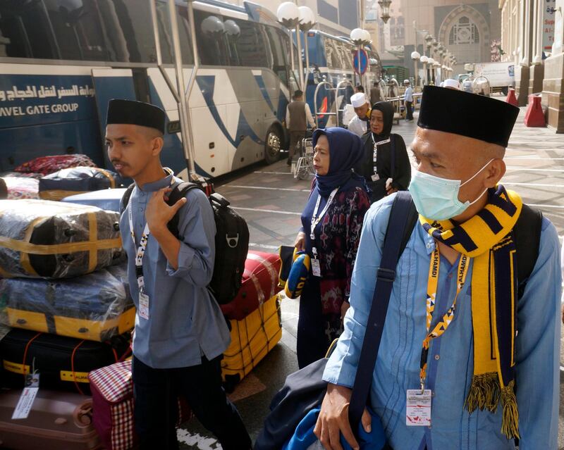 Indonesian pilgrims, who entered Mecca before visas were halted, wait their bus to leave home in Makkah. AP Photo