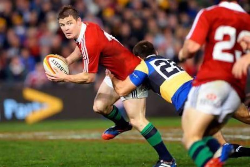 British and Irish Lions captain Brian O'Driscoll, left, is tackled by Combined Country player Dale Ahwang during their rugby union tour match in Newcastle on Tuesday. William West / AFP