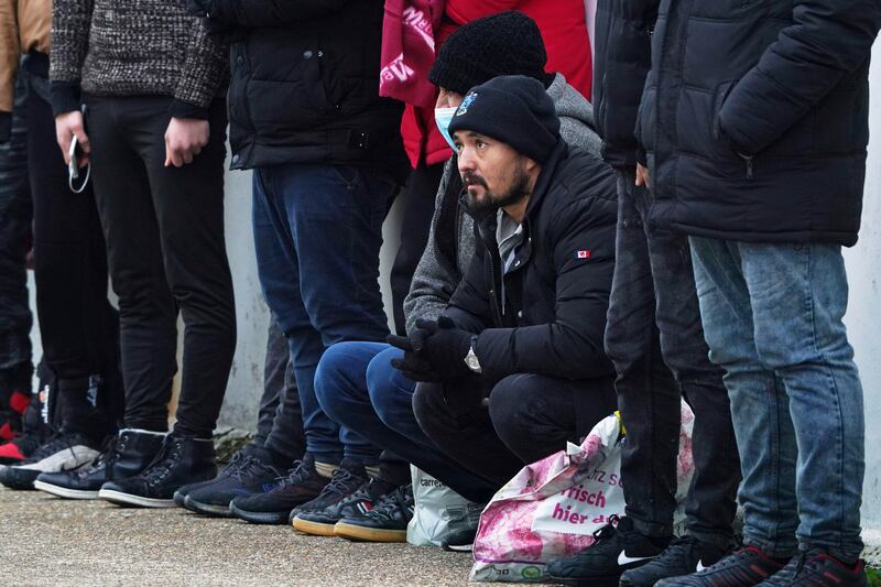 A group of people, thought to be migrants, at Dungeness lifeboat station, Kent. AP Photo